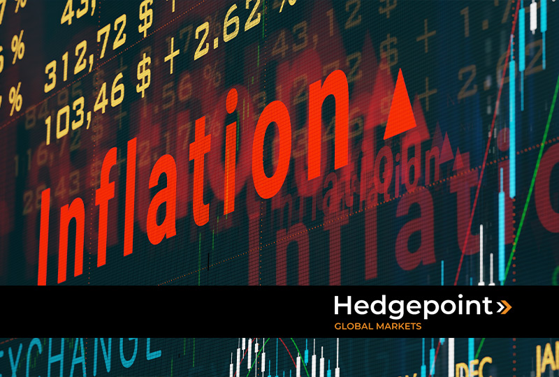 Imagem de painel da bolsa de valores exibindo a relação entre commodities e inflação.